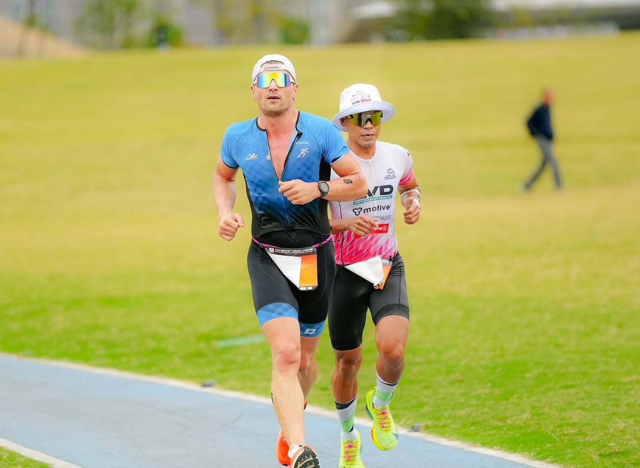 Two athletes running together